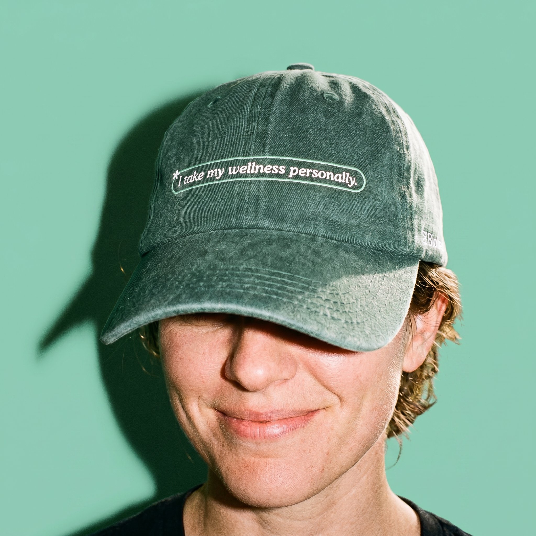 Bioligent dad hat, embroidered with 'I take my wellness personally.'